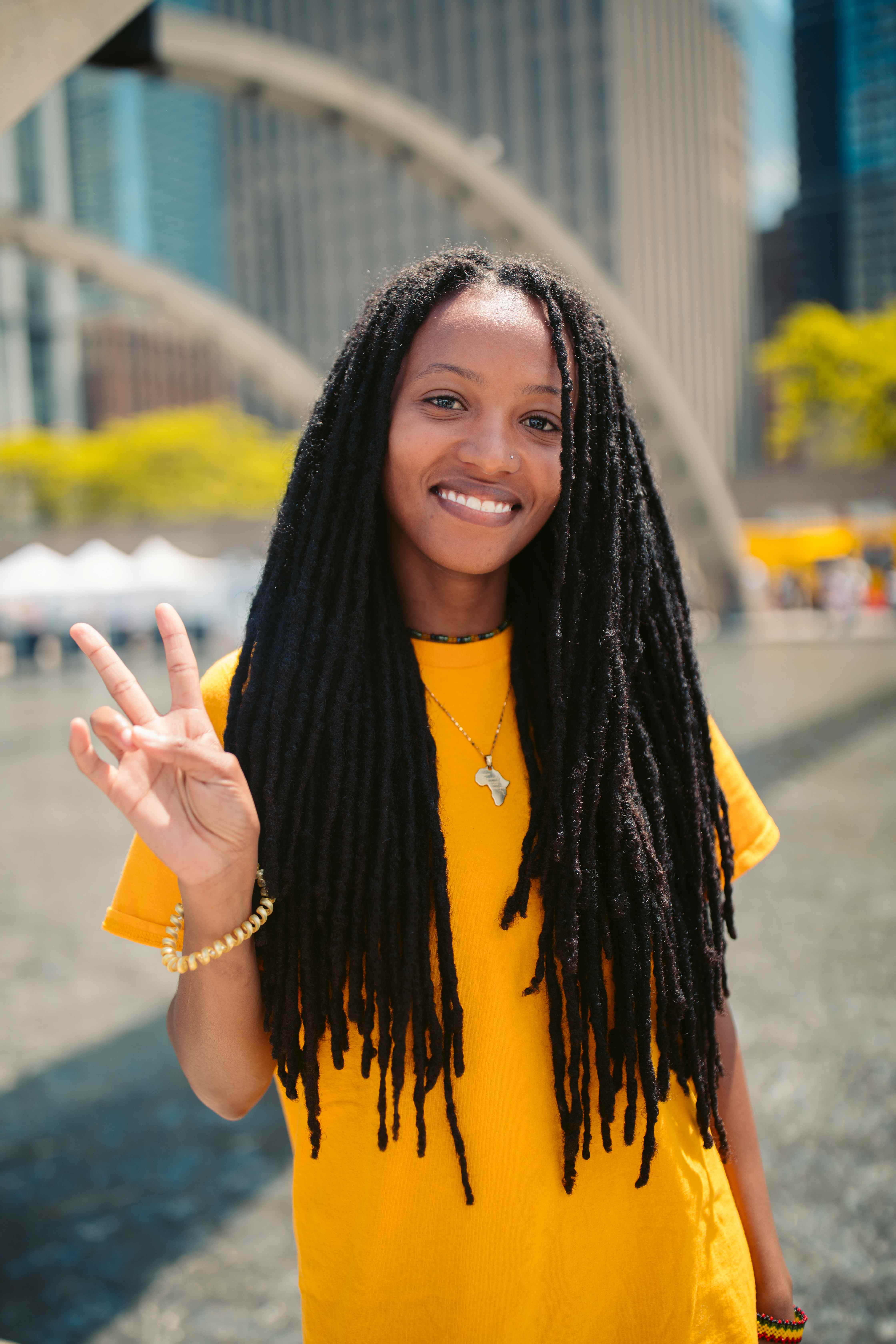 Newcomer making peace sign
